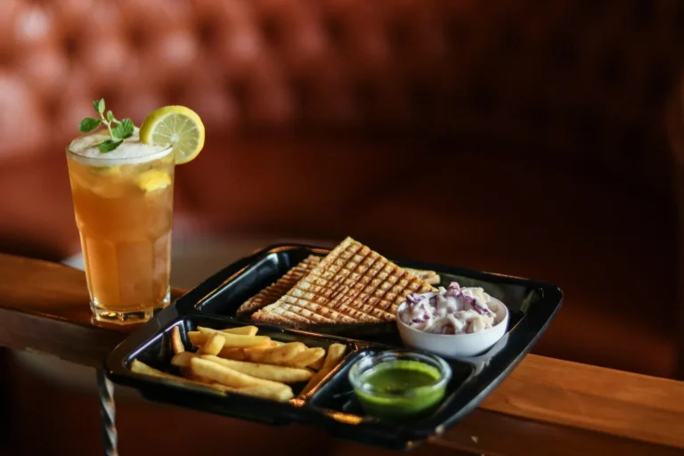 Club sandwich, fries and a tropical drink at Haleiwa Beach House