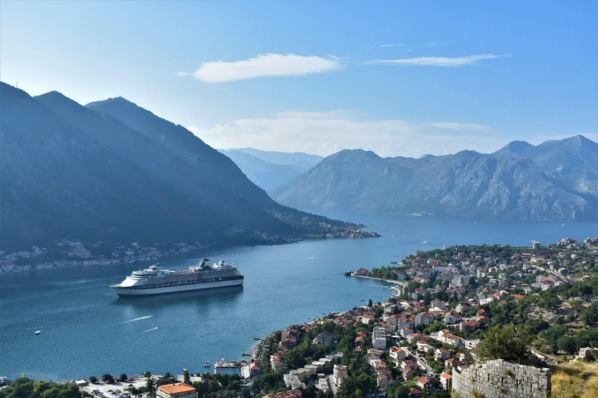 Calm water of the Bay of Kotor with mountains rising behind