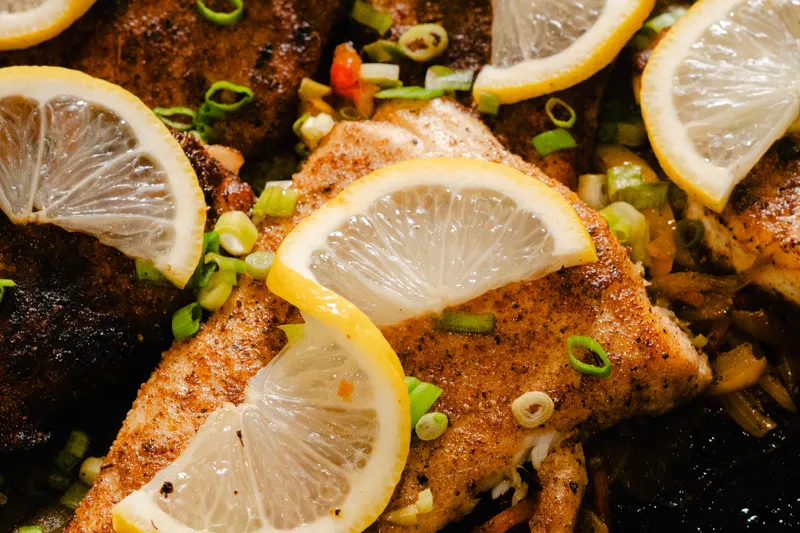 Grilled fish with lemon, the kind of seafood plate served at Fresco's Waterfront Bistro