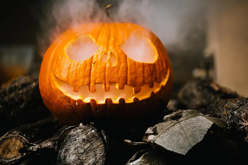 Halloween pumpkins lit up in a town ready for a spooky trip