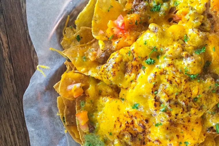 Loaded nachos with melted cheese, a favourite at Uncle Bo's Haleiwa