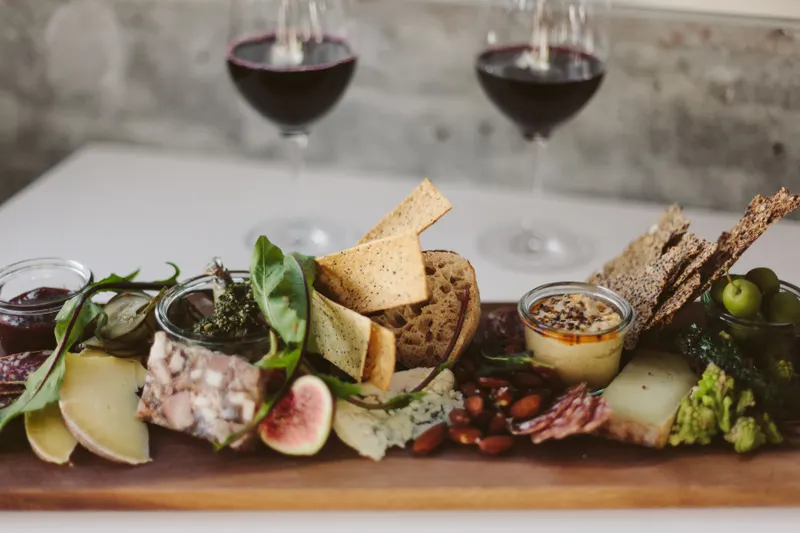 Charcuterie board with glasses of wine, as served at Lolita's Wine Market