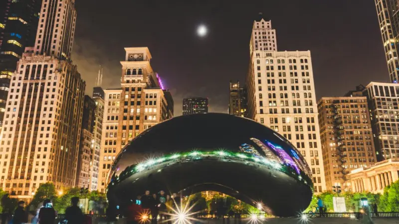 Cloud Gate, The Bean, lit up at night in Millennium Park in the Loop
