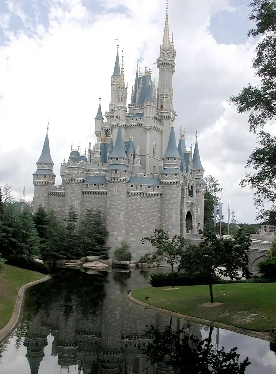 Castle reflected in a pond, scenery for a Disney World